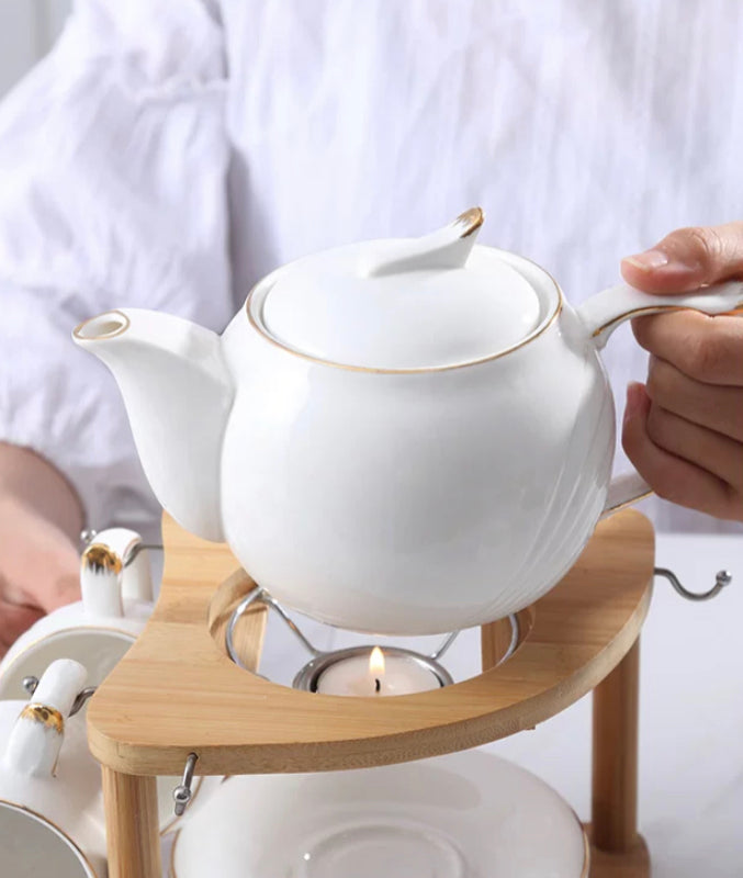 Tea set with wooden stand with candle warming base
